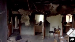 This image taken from a video shows a damaged building in the Belgorod region, Russia, May 22, 2023. 