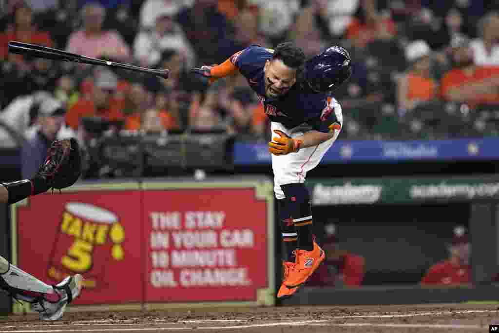 Houston Astros' Jose Altuve reacts after being hit by a pitch thrown by Washington Nationals starting pitcher Josiah Gray during the first inning of a baseball game, June 14, 2023, in Houston, Texas.