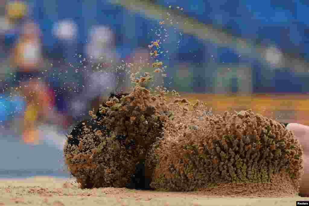 Turkey&#39;s Ecem Calagan lands in the sand after sustaining an injury during the Women&#39;s Long Jump during the European Games Athletics Championships at the Silesian Stadium in Chorzow, Poland.
