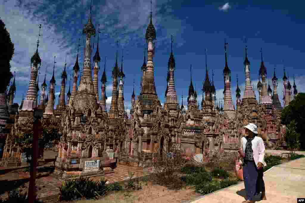A visitor walks past stupas at the Kakku pagoda complex near Taunggyi township in Myanmar's southern Shan state.