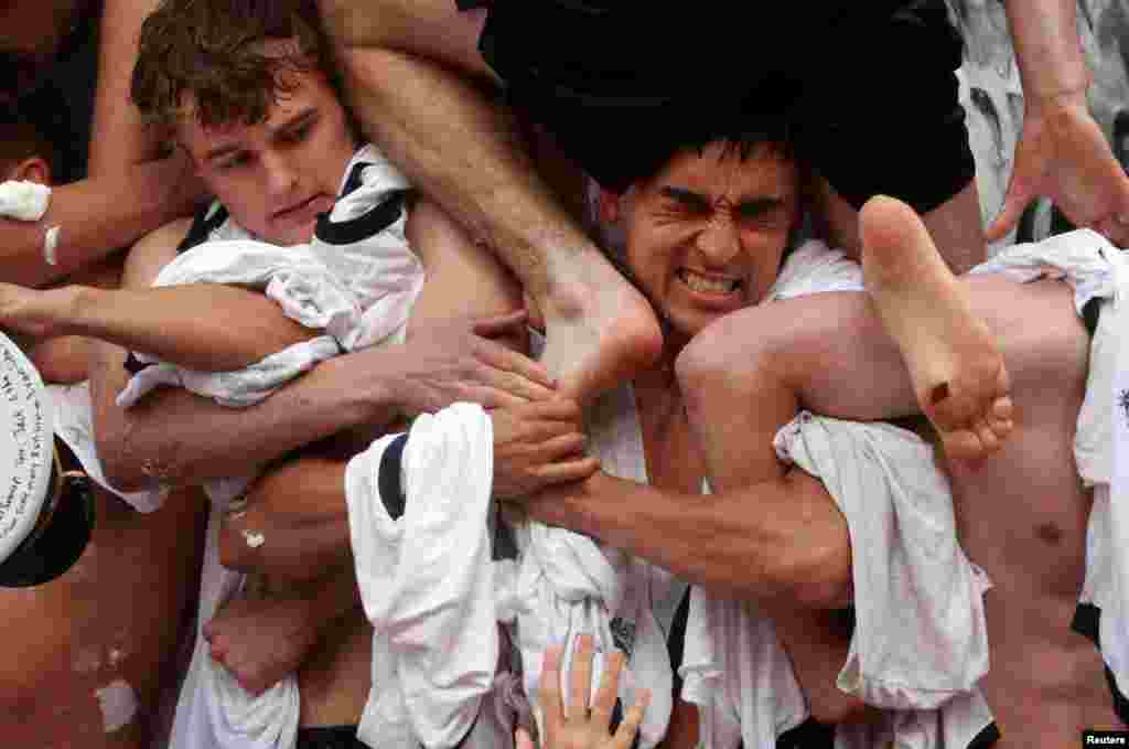 Members of U.S. Naval Academy's first year "Plebe" class take part in the annual "Herndon Climb" in Annapolis, Maryland, May 17, 2023. 