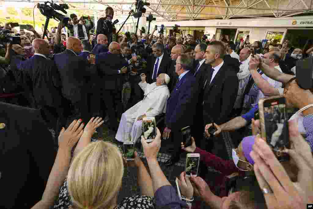 Pope Francis leaves the Agostino Gemelli University Polyclinic in Rome, nine days after undergoing abdominal surgery.