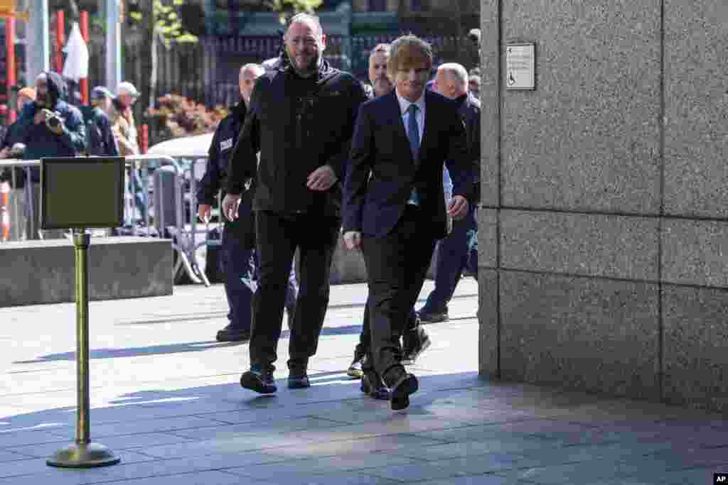 Ed Sheeran walks into Manhattan federal court in New York. The heirs of Ed Townsend, Marvin Gaye's co-writer of the 1973 soul classic, sued Sheeran, alleging the English pop star's hit 2014 tune has “striking similarities” to “Let's Get It On” and “overt common elements” that violate their copyright.