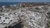 In this photo shot with a drone, shrimp boats lie grounded atop what was a mobile home park, following the passage of Hurricane Ian, on San Carlos Island in Fort Myers Beach, Fla., Oct. 7, 2022. 