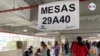 Colombianos votan en la primera vuelta de las elecciones presidenciales en Colombia, el domingo 29 de mayo de 2022, en el Centro Comercial Unicentro, en Bogotá. [Foto: Karen Sánchez]