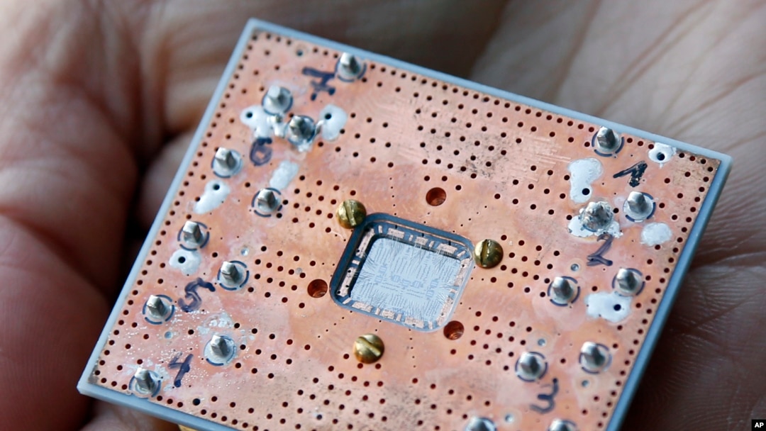 This Feb. 27, 2018, photo shows a seven cubit quantum device is seen at the IBM Thomas J. Watson Research Center in Yorktown Heights, New York.