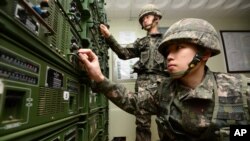 South Korean army soldiers work on equipment used for propaganda broadcasts near the border area between South Korea and North Korea in Yeoncheon, South Korea, Friday, Jan. 8, 2016.