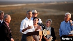 U.S. President Barack Obama speaks during a visit to a drought affected farm in California on Feb. 14, 2014.