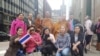 A group of local Thai supporters greet Phra Sutham Nateetong, the monk who is walking for peace across America at the end-point of the walk in Chicago downtown area at 5 pm June 3, 2019.