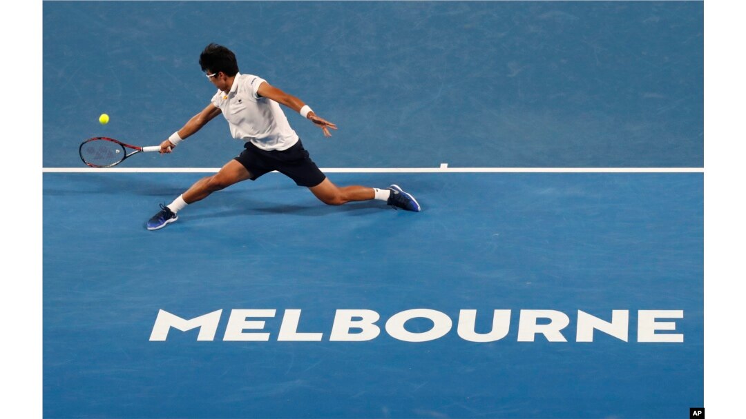 South Korea's Chung Hyeon makes a backhand return to Serbia's Novak Djokovic
