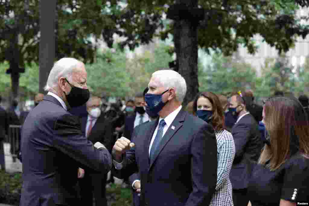 Democratic presidential candidate and former U.S. Vice President Joe Biden and Vice President Mike Pence greet each other during the 19th anniversary of the 9/11 attacks at the National September 11 Memorial & Museum in New York City, New York.