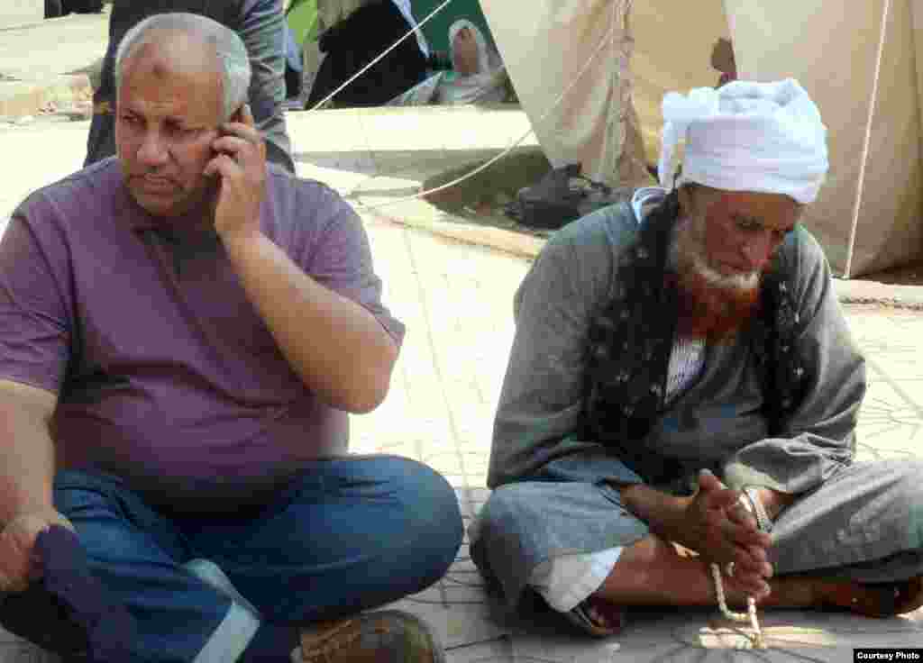 Muslim Brotherhood supporters sitting outside Cairo's Rabaa al-Adawiya mosque, July 11. Photo: VOA/Sharon Behn