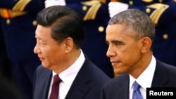 Tổng thống Mỹ Barack Obama và Chủ tịch Trung Quốc Tập Cận Bình tại Bắc Kinh, ngày 12/11/2014. Chính quyền Obama đã cảnh báo Trung Quốc về sự hiện diện của các nhân viên thi hành công lực của nước này ở Hoa Kỳ bí mật làm áp lực buộc những người nổi tiếng đang sống lưu vong phải trở về nước.