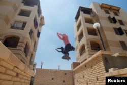 Egyptian women in the Parkour Egypt "PKE" group train in Cairo, July 20, 2018. Picture taken July 20, 2018. REUTERS/Amr Abdallah Dalsh