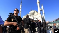 A Turkish special security force member stands during a mass funeral for the victims of a failed military coup last Friday, at Kocatepe Mosque in Ankara, Turkey, July 17, 2016.
