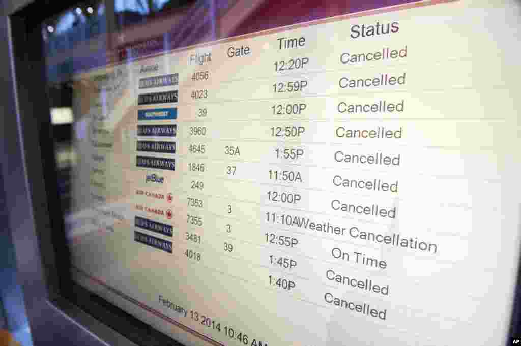 Departures are canceled due to snow at Washington's Ronald Reagan National Airport, Feb. 13, 2014.