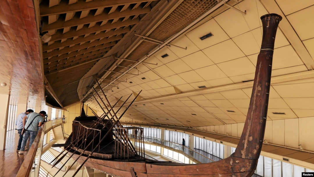 FILE - King Khufu's solar boat is displayed at a museum on the northern side of Khufu's Great Pyramid, in Giza, Egypt, Aug. 31, 2016. 