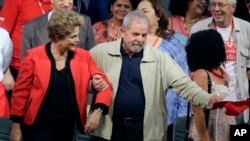 FILE - In this Oct.13, 2015 file photo, Brazil's former President Luiz Inacio Lula da Silva, right, and current President Dilma Rousseff, attend the Central Workers Union annual convention in Sao Paulo, Brazil. The Brazilian government's leader in the lower house of Congress said Wednesday, March 16, 2016, that Silva has been named chief of staff to Rousseff. It's a move that could help Silva avoid possible detention in expanding corruption probes that have now touched the top of Brazil's political leadership. (AP Photo/Nelson Antoine, File)