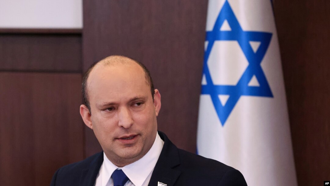 Israeli Prime Minister Naftali Bennett chairs the first weekly cabinet meeting of the new government in Jerusalem, Sunday, June 20, 2021. Bennett opened his first Cabinet meeting with a condemnation of the newly elected Iranian president, whom he…