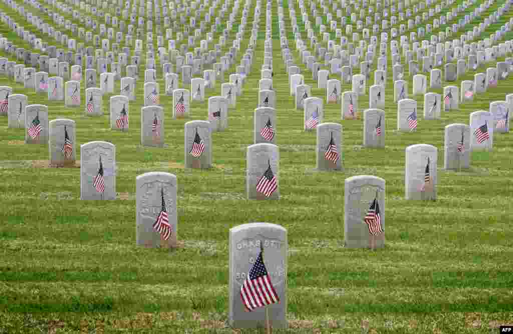 The graves of war veterans are seen during the annual &#39;Flag Placement Ceremony&#39; to honor the fallen for Memorial Day at the Los Angeles National Cemetery, California, May 25, 2019.