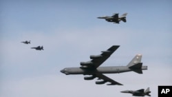 A U.S. Air Force B-52 bomber flies over Osan Air Base in Pyeongtaek, South Korea, Jan. 10, 2016. The bomber flew low over South Korea on Sunday, a show of force from the U.S. as a Cold War-style standoff deepened between ally Seoul and North Korea.