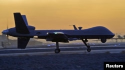 FILE - A MQ-9 Reaper drone taxis at Kandahar Airfield, Afghanistan in this Dec. 27, 2009 photo. The U.S. State Department has approved a longstanding request from Italy to arm its two MQ-9 Reaper drones with Hellfire missiles, laser-guided bombs and other