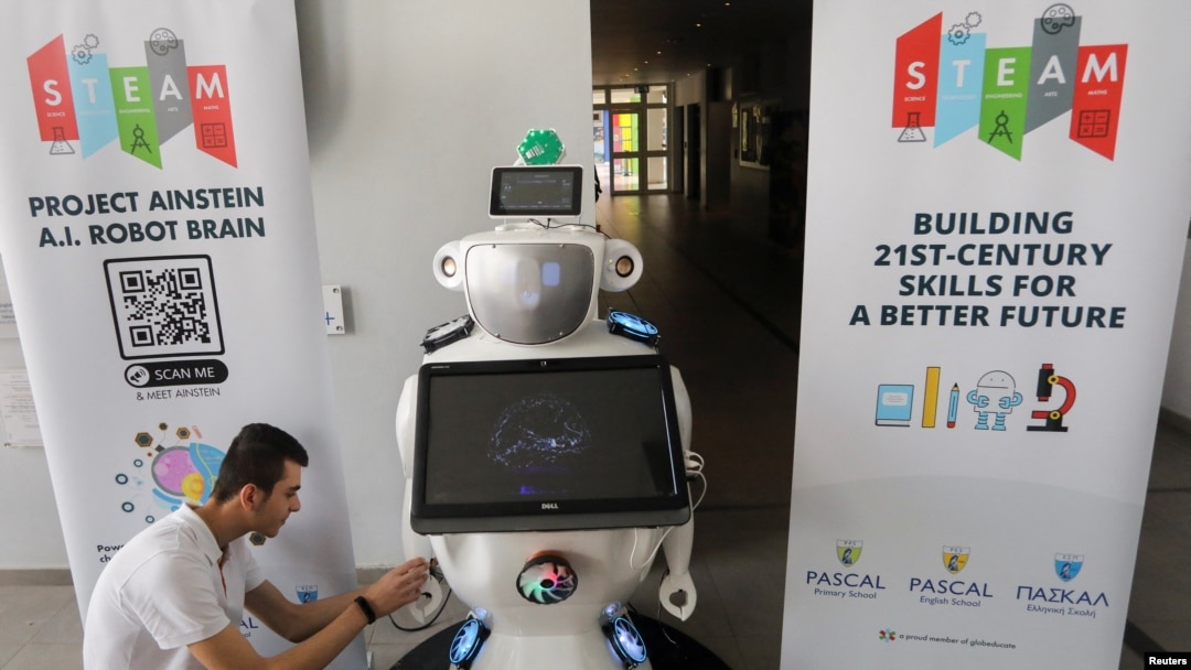 High school student Konstantinos Timinis works on "Alnstein", a robot powered with ChatGPT, in Pascal school in Nicosia, Cyprus on March 30, 2023. (REUTERS/Yiannis Kourtoglou)