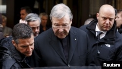 FILE - Australian Cardinal George Pell leaves at the end of a meeting with the victims of sex abuse, at the Quirinale hotel in Rome, Italy, March 3, 2016. (REUTERS/Alessandro Bianchi)